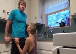 Busty mom kneels to suck son's dick